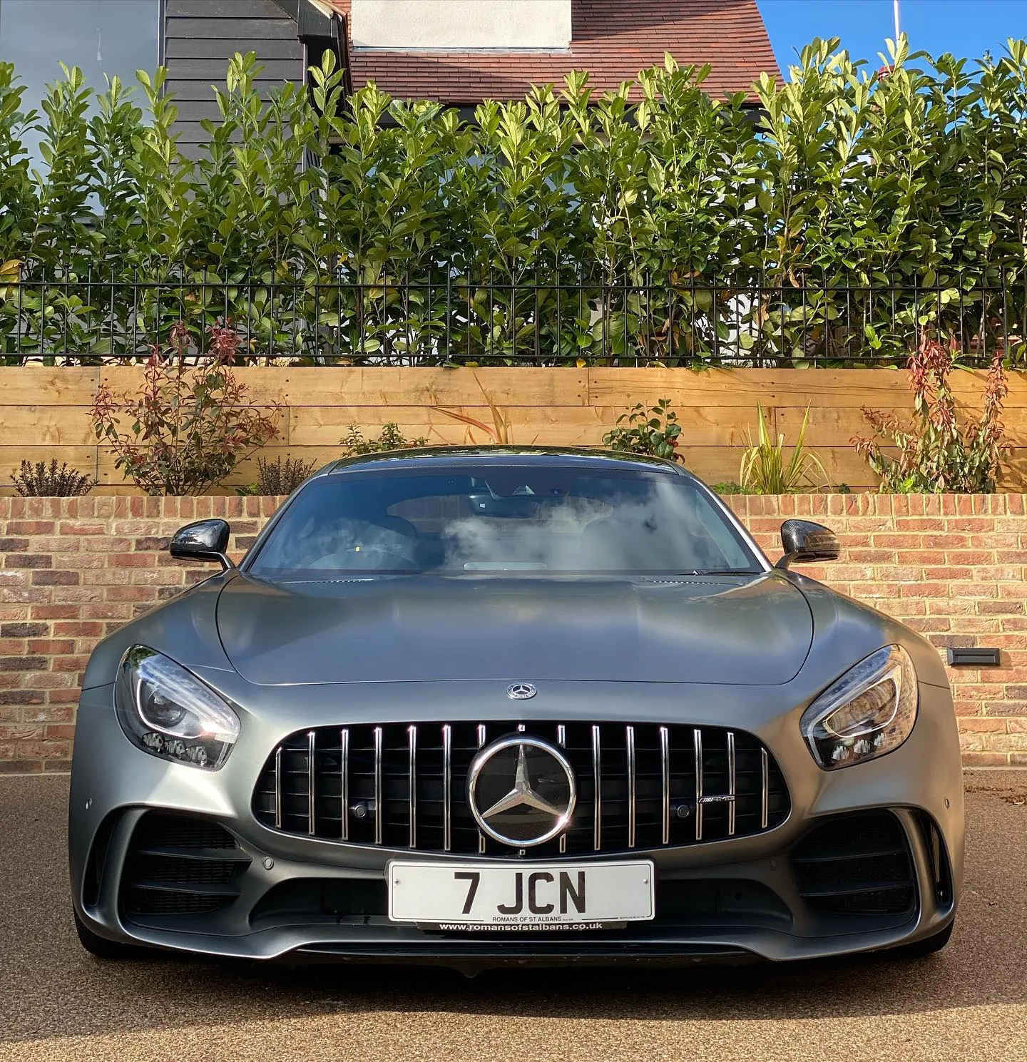 Grey Mercedes-AMG GT with a mirror finish after paint correction